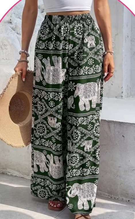 Model wearing green wide-leg pants with a white elephant print