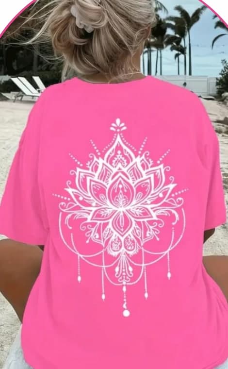 Model wearing a pink oversized tee with a white lotus mandala print on the back