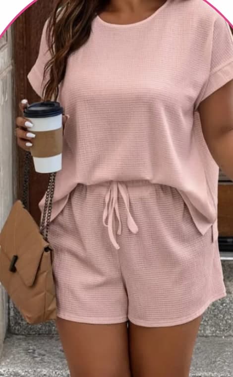 Model wearing a pink waffle-knit top and shorts co-ord set