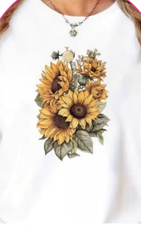 Model wearing a white tee with a sunflower bouquet graphic